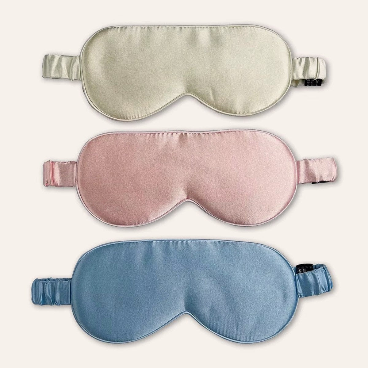 Masques de nuit en soie, coloris ivoire, rose et bleu